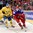 TORONTO, CANADA - JANUARY 4:  Russiaâ€™s Maxim Mamim #18 pulls the puck away from Swedenâ€™s Gustav Forsling #8 during semifinal round action at the 2015 IIHF World Junior Championship. (Photo by Richard Wolowicz/HHOF-IIHF Images)